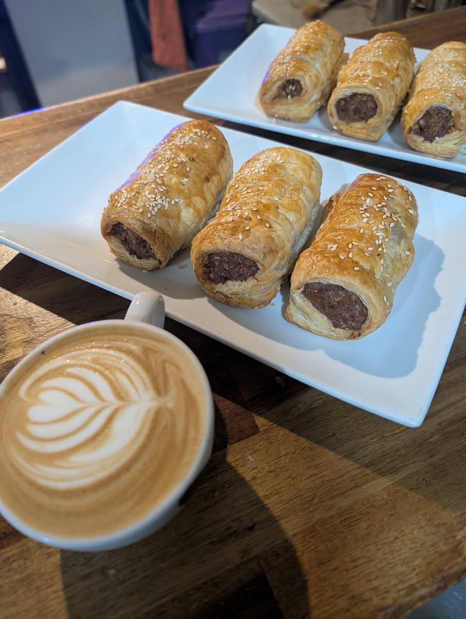 Freshly baked sesame pastry rolls on the counter